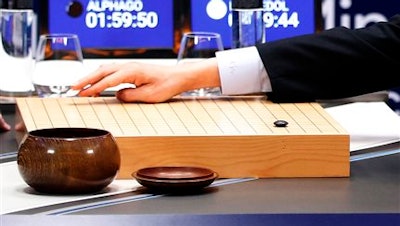 South Korean professional Go player Lee Sedol puts the first stone against Google's artificial intelligence program, AlphaGo during the second match of the Google DeepMind Challenge Match in Seoul, South Korea, Thursday, March 10, 2016. Google's computer program AlphaGo defeated its human opponent, South Korean Go champion Lee Sedol, on Wednesday in the first face-off of a historic five-game match.