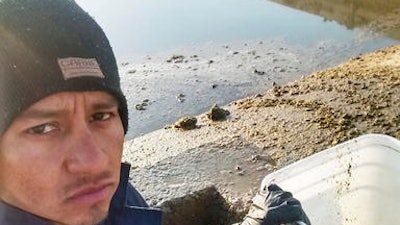 This 2015 self-portrait by César Nerón Martínez Rodríguez shows him at work at the Funk Dairy in Murtaugh, Idaho. He is one of six veterinarians who say they were recruited from Mexico to work at the Idaho dairy farm as animal scientists, but were instead forced to work as laborers, milking cows and shoveling manure for about a year. On Tuesday, Jan. 3, 2017, they filed a federal human trafficking lawsuit against the dairy's owners and the lawyer who arranged work visas.