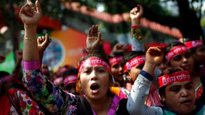 Bangladeshi garment workers shout slogans as they participate in a May Day rally in Dhaka, Bangladesh, Monday, May 1, 2017. Thousands of workers and activists marched during International Workers Day demanding higher wages and better work conditions.