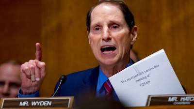 In this Sept. 25, 2017, file photo, Sen. Ron Wyden, D-Ore., speaks on Capitol Hill in Washington. Wyden wants to know how well prepared the country’s top voting machine manufacturers are against hackers. In letters shared with The Associated Press, Wyden asks the CEOs of six election technology firms to answer a range of questions detailing how they protect sensitive voter data and test their own internal security systems.