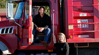 Chad Jarreau poses with his wife Penny Jarreau in front of one of their dump trucks in Cutt Off, La., Tuesday, Oct. 24, 2017. Jarreau had land taken from him by the local bayou districts. They are asking the Supreme Court for help after the local flood control district took some of his land and part of his livelihood, paying him a pittance.