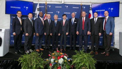 Samsung celebrates the ribbon cutting of the first commercial washers being produced at the Newberry, SC plant. Pictured from left are: Young-jun Kim, Korean Consul General in Atlanta; Joon So, President of Samsung Electronics Home Appliances America; U.S. Senator Tim Scott; Newberry County Administrator Wayne Adams; South Korean Ambassador to the U.S., Yoon-Je Cho; President and Head of Consumer Electronics Division of Samsung Electronics, H.S. Kim; South Carolina Governor Henry McMaster; U.S. Representative Ralph Norman; Deputy Assistant Secretary of Manufacturing at the U.S. Department of Commerce, Ian Steff; President and CEO of Samsung Electronics North America Tim Baxter.