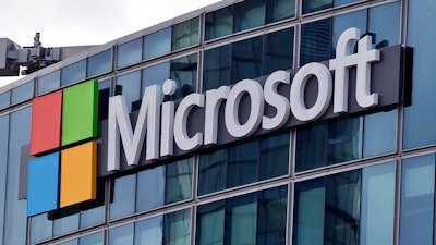 This April 12, 2016, file photo shows the Microsoft logo in Issy-les-Moulineaux, outside Paris, France. Microsoft has an eye on its international customers as it confronts the Trump administration in a Supreme Court fight about turning over emails to investigators. The justices will hear arguments Feb. 26, 2018, over whether the company, as part of an international drug trafficking investigation, must comply with an American warrant for emails stored on a server in a Microsoft facility in Dublin, Ireland.