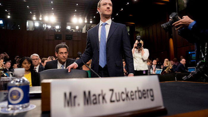 Facebook CEO Mark Zuckerberg arrives to testify before a joint hearing of the Commerce and Judiciary Committees on Capitol Hill in Washington, Tuesday, April 10, 2018, about the use of Facebook data to target American voters in the 2016 election.