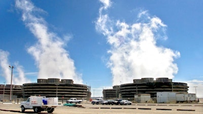 In this April 8, 2003, file photo, steam rises from the Columbia Generating Station, Washington state's only nuclear power plant, near Richland, Wash. The nuclear power plant in southeastern Washington state closed unexpectedly. The Tri-City Herald reports that the Columbia Generating Station's systems detected a problem Friday May 18, 2018, having to do with electrical distribution and automatically shut the plant down. Authorities said there is no risk to the public.