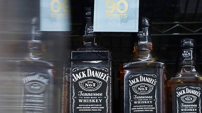 This July 9, 2018 photo shows bottles of Jack Daniel's whiskey displayed at Rossi's Deli in San Francisco. China's government vowed Wednesday, July 11, to take 'firm and forceful measures' as the U.S. threatened to expand tariffs to thousands of Chinese imports. After the U.S. imposed 25 percent tariffs on $34 billion worth of Chinese goods, China retaliated by imposing tariffs on the same amount of U.S. products including whiskey.