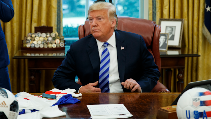 President Donald Trump listens to a question during a meeting with FIFA president Gianni Infantino and United States Soccer Federation president Carlos Cordeiro in the Oval Office of the White House, Tuesday, Aug. 28, 2018, in Washington.