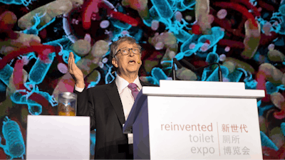 Bill Gates, former Microsoft CEO and co-founder of the Bill and Melinda Gates Foundation, speaks as a jar of human feces sits on a podium at the Reinvented Toilet Expo in Beijing, Tuesday, Nov. 6, 2018. With a jar of human feces on a podium next to him, billionaire philanthropist Bill Gates has kicked off a 'Reinvented Toilet' Expo in China. Gates said Tuesday that the technologies on display at the three-day expo in Beijing represent the most significant advances in sanitation in nearly 200 years.
