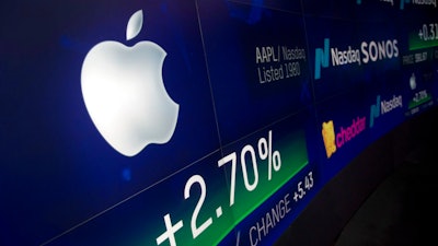 In this Aug. 2, 2018, file photo an electronic screen displays Apple stock at the Nasdaq MarketSite in New York. Apple became the first U.S. company valued at $1 trillion in August.