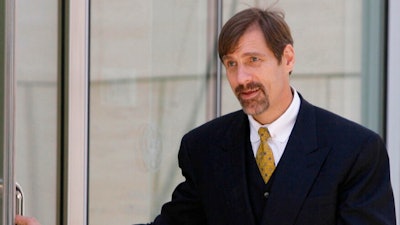 In this June 16, 2008, file photo, Broadcom co-founder Henry T. Nicholas III leaves the Ronald Reagan Federal Building after a hearing in Santa Ana, Calif. Authorities in Nevada have filed felony drug charges against the California tech billionaire and victim rights advocate arrested in August with what police said were briefcases full of drugs. Nicholas and a woman arrested with him, Ashley Fargo, were named in a complaint filed Wednesday, Feb. 13, 2019, in state court in Las Vegas.