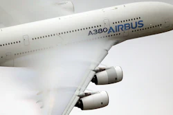 In this June 18 2015 file photo, vapor forms across the wings of an Airbus A380 as it performs a demonstration flight.