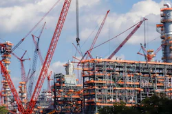 This file photo from Oct. 3, 2019 shows cranes as they work on construction of the Shell Pennsylvania Petrochemicals Complex and ethylene cracker plant located in Potter Township, Pa. Under mounting pressure from state and local officials, Shell announced it is suspending construction at its massive manufacturing complex in western Pennsylvania. The company said Wednesday, March, 18, 2020 that it's temporarily halting work at its soon-to-be-completed plant which will turn the area's vast natural gas deposits into plastics. The shutdown takes effect immediately.