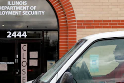 A man looks at the closed sign in front of Illinois Department of Employment Security in Chicago, Wednesday, April 15, 2020. With half-a-million people bounced out of jobs in the past month because of the COVID-19 pandemic, Illinois' unemployment safety net has been stretched to the limit.