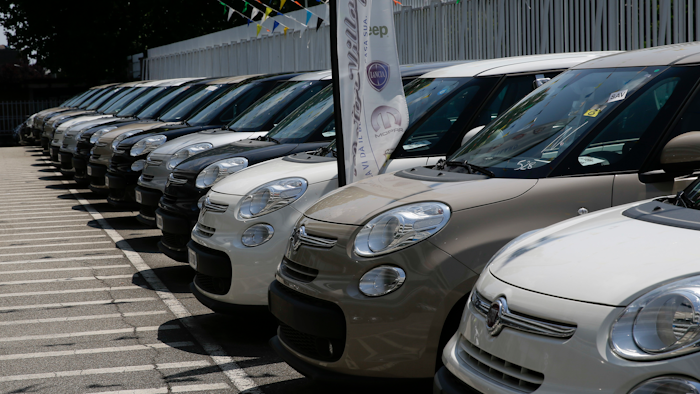 Cars are parked at a Fiat Chrysler car dealer in Milan, Italy.