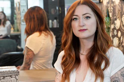 Hairstylist Lacey Ward poses for a photo at the Grey House Salon she co-owns, in Omaha, Neb., Thursday, April 30, 2020.