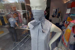 A mannequin displays fashion masks for shoppers the buy at the Highland Park Village shopping center in Dallas.