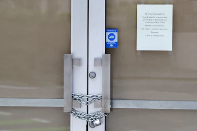 In this May 6 photo, a chain lock is shown on the entry doors to Zane + Wylie's Seattle Steakhouse restaurant in downtown Seattle.