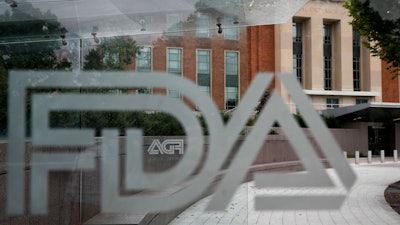 U.S. Food and Drug Administration building behind FDA logos.