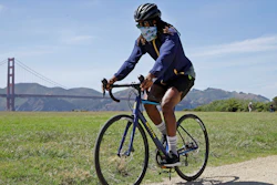 Joel Johnson rides his new bicycle .