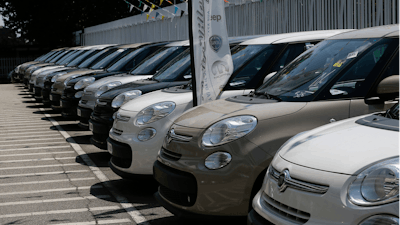 Cars are parked at a Fiat Chrysler car dealer in Milan, Italy.