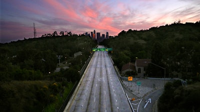 In this April 26, 2020 photo, empty lanes of the 110 Arroyo Seco Parkway that leads to downtown Los Angeles is seen during the coronavirus outbreak..