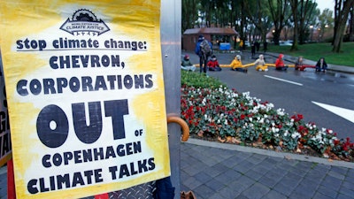 Demonstrators block the main entrance of Chevron Corp. in San Ramon, Calif.