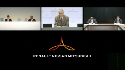 Alliance Operating Board Chairman Jean-Dominique Senard, center, Nissan Chief Executive Makoto Uchida, left, and Mitsubishi Motors Chairman, Osamu Masuko, second right, listen to a reporter's question during an online news conference.