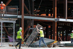 Workers build a protective barrier as construction resumed on the New York Islanders' new arena, located adjacent to Belmont race track, during the current coronavirus outbreak on Wednesday, May 27 in Elmont, NY.