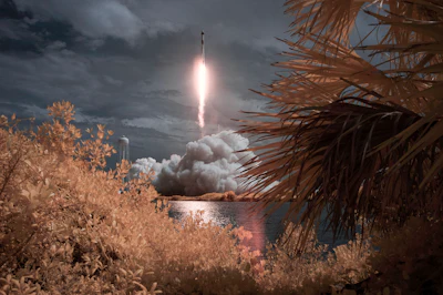 In this photo provided by NASA, a SpaceX Falcon 9 rocket carrying the company's Crew Dragon spacecraft is seen in this false color infrared exposure as it is launched on NASA's SpaceX Demo-2 mission to the International Space Station with NASA astronauts Robert Behnken and Douglas Hurley onboard, Saturday, May 30, 2020, at NASA's Kennedy Space Center in Cape Canaveral, Florida.