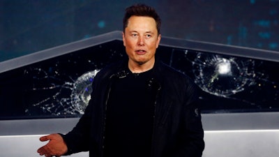 In this Nov. 21, 2019, file photo, Tesla CEO Elon Musk introduces the Cybertruck at Tesla's design studio in Hawthorne, Calif. Tesla CEO Elon Musk appears to have hit all the milestones necessary to receive a stock award currently worth about $730 million to pad the eccentric billionaire's already vast fortune. The electric car maker ended Wednesday, May 6, 2020, with an average market value of $100.4 billion for the past six months, according to data drawn from FactSet Research.