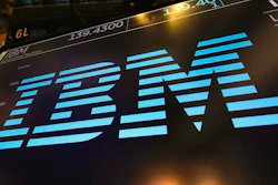 In this March 18, 2019, file photo, the logo for IBM appears above a trading post on the floor of the New York Stock Exchange. IBM says it’s laying off an undisclosed number of workers across the U.S., according to the Wall Street Journal and other reports.