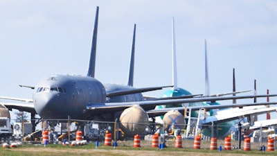 In this April 7, 2020, file photo, U.S. Air Force KC-46 tankers being built by Boeing sit parked at the Paine Field airport in Everett, Wash. Federal safety regulators are outlining planned changes in how they approve new passenger airplanes after two crashes involving a Boeing model. But key lawmakers say they plan to push ahead with legislation to change the current system that lets aircraft makers including Boeing play a key role in certifying their own planes.