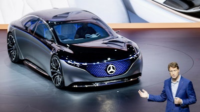 Ola Kaellenius, head of Mercedes-Benz, next to a Vision EQS car at the IAA Auto Show, Frankfurt, Germany, Sept. 10, 2019.