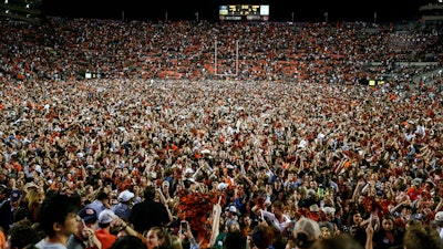 Fans storm the field after Auburn defeated Alabama 48-45 in Auburn, Ala., Nov. 30, 2019.