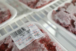 Packages of meat sit in a cooler at a local super market.