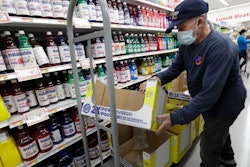 Juan Santos stocks shelves at the Presidente Supermarket in the Little Havana neighborhood of Miami.