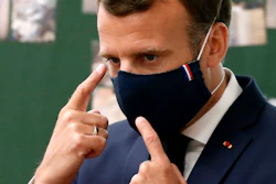 French President Emmanuel Macron wears a protective face mask.