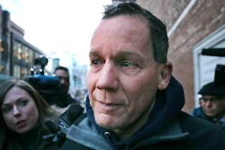Harvard University professor Charles Lieber leaves federal court in Boston.