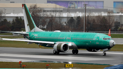 A Boeing 737 Max being built for Norwegian Air International taxis for a test flight.