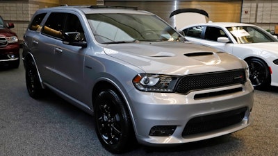 This Feb. 13, 2020 photo shows a 2020 Dodge Durango R/T Blackktop AWD on display at the 2020 Pittsburgh International Auto Show in Pittsburgh. Detroit-area automakers made their strongest showing ever in an annual survey of vehicle quality, Wednesday, June 24, as once-dominant Japanese brands faded. Most Detroit-area brands outpaced the industry average in problems per 100 vehicles, with Fiat Chrysler’s Dodge brand surprisingly tying for first place with Kia of South Korea.