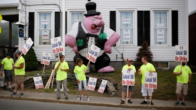 Strikers picket outside the district lodge of Local 6 across from Bath Iron Works.
