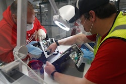In this May 13 photo, Ford Motor Co. employees work a ventilator at the Rawsonville plant in Ypsilanti Township, Mich. The plant was converted into a ventilator factory, as hospitals battling the coronavirus report shortages of the life-saving devices.