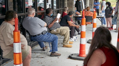 Job seekers at the Heartland Workforce Solutions office in Omaha, Neb., July 15, 2020.