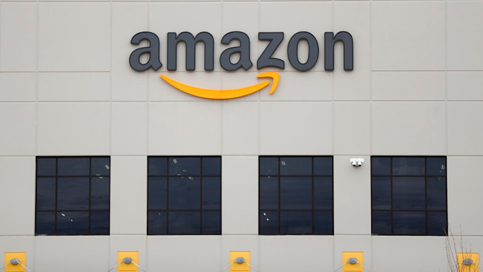 The Amazon DTW1 fulfillment center is shown in Romulus, Mich. Amazon is heading to space. The online shopping giant received government approval to put more than 3,200 satellites into orbit that would beam down internet service to earth. Amazon said the satellites could provide internet to parts of the world that don’t have it.