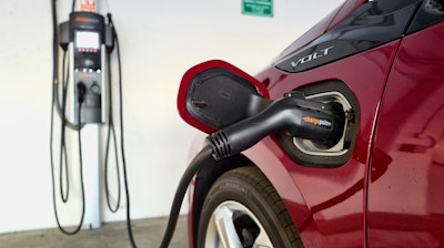 A Chevrolet Volt hybrid car charging.