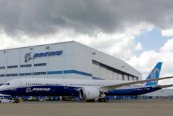 Boeing employees stand near the new Boeing 787-10 at the company's facility in North Charleston, S.C.