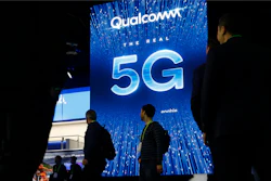 A sign advertises 5G at the Qualcomm booth at CES International in Las Vegas.