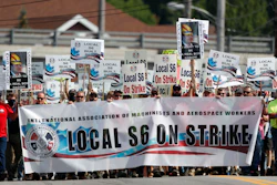 Striking Bath Iron Works shipbuilders march in solidarity.