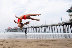 A student works on her skills during an acrobatics class near the pier in Huntington Beach, CA.