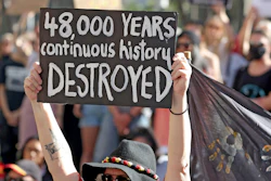 Protesters rally outside the Rio Tinto office in Perth, Australia.